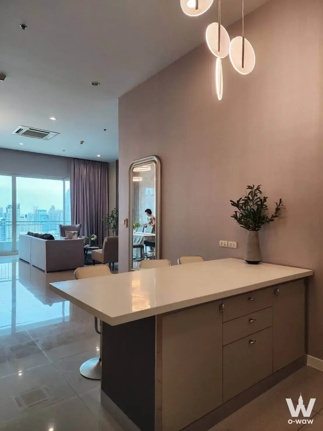3-bed condo for rent in Circle Condominium with beige tile, quartz bar, and city skyline view