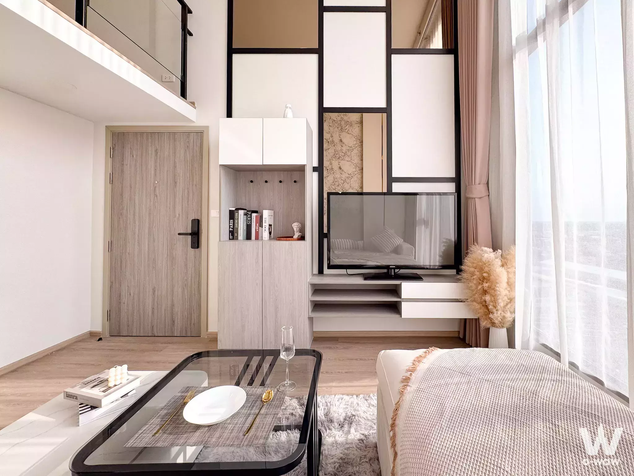 Modern 1-bed condo for sale in Nonthaburi with mezzanine, built-in storage, and city views