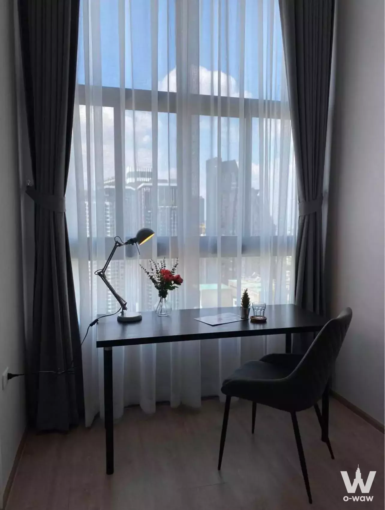 Home office nook with desk and city view in 1-bed condo for rent at IDEO Rama 9 - Asoke Bangkok