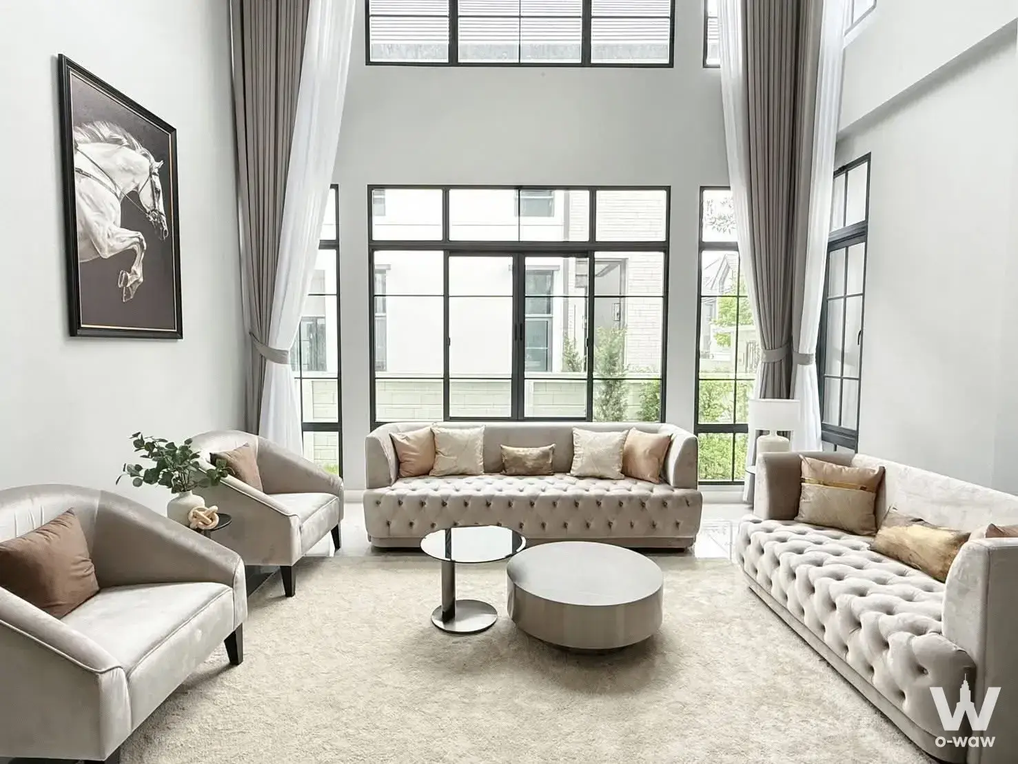 Spacious double-height living room with floor-to-ceiling windows in 5-bed house for rent at THE CITY Bangna 2