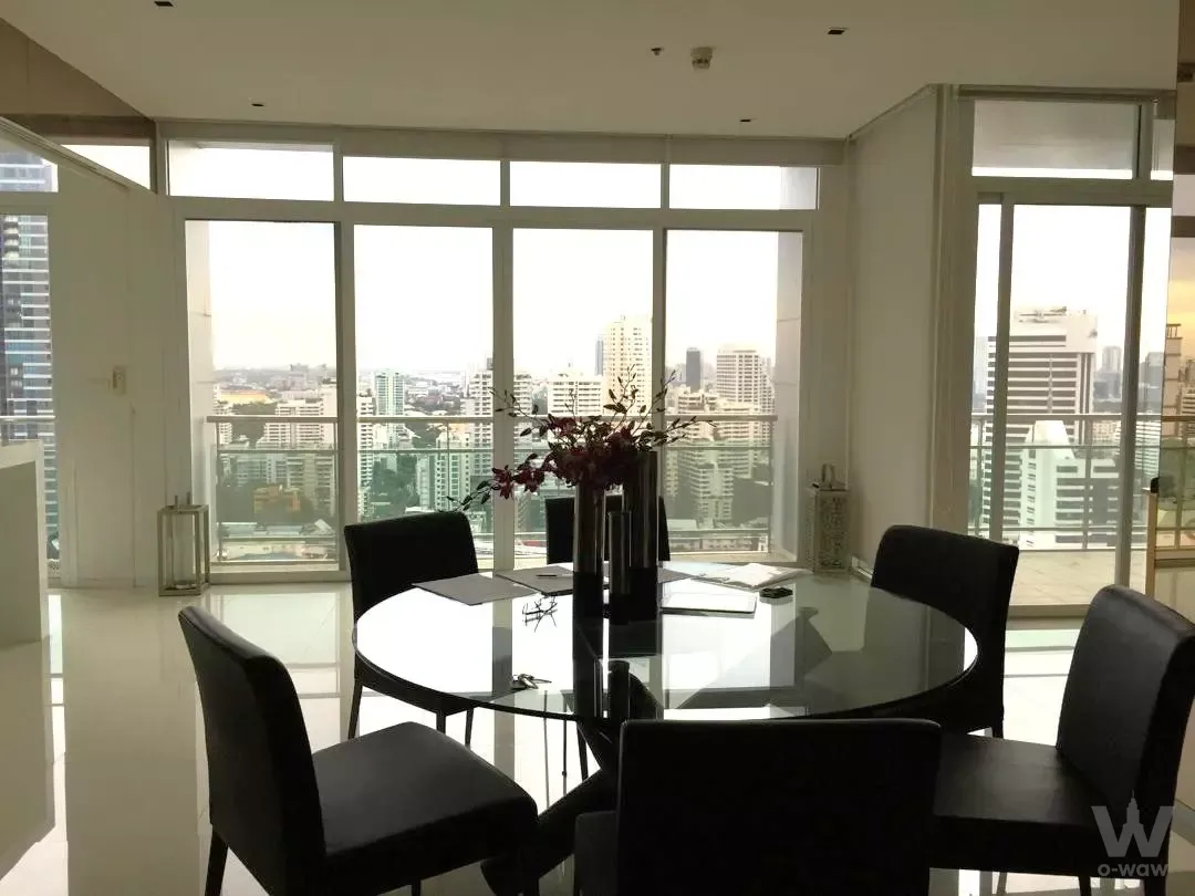 Bright dining area in 2-bed condo for sale at The Prime 11 Condo featuring floor-to-ceiling windows and city views