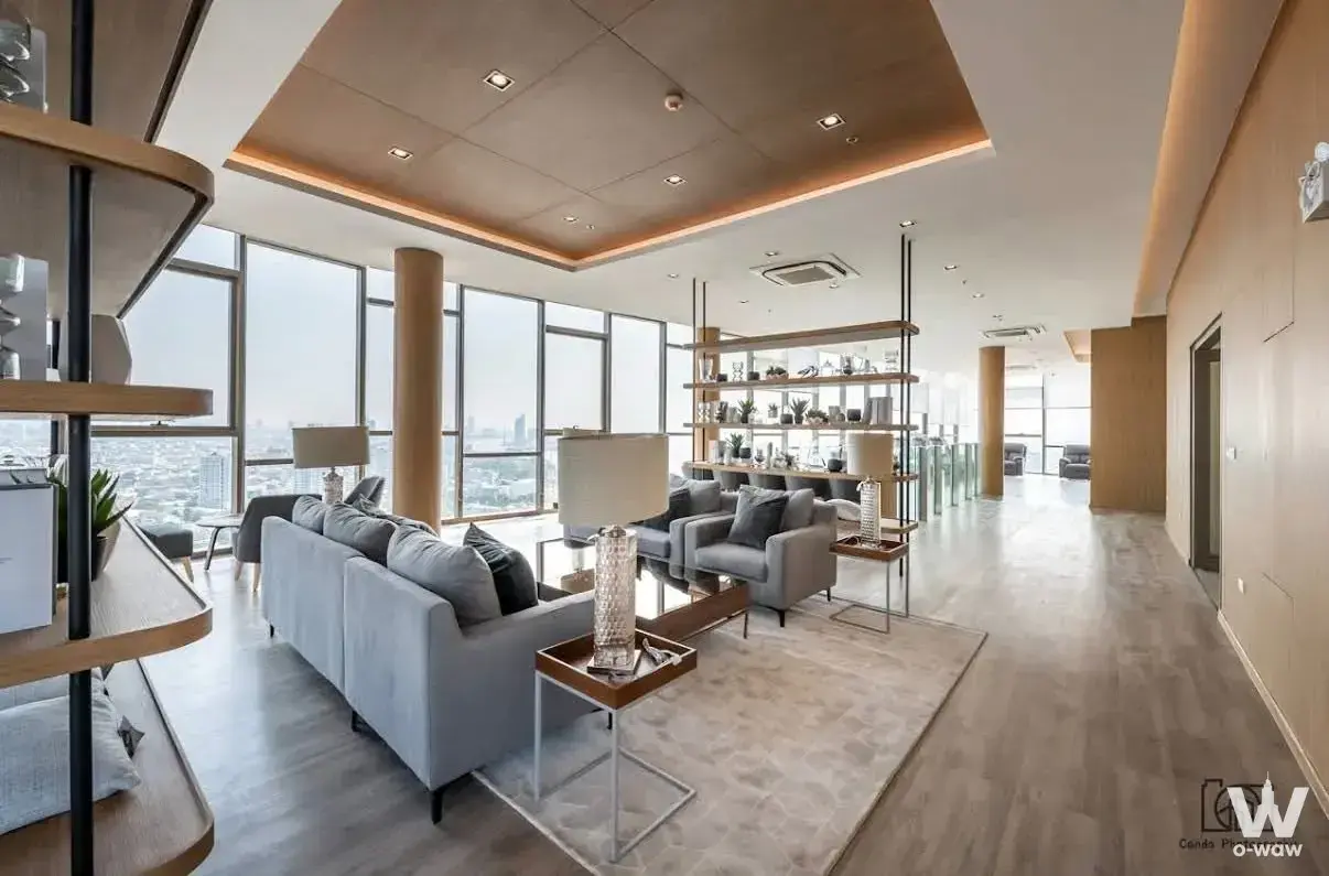 Spacious living room in 1-bed condo for rent at Niche MONO Charoen Nakhon with floor-to-ceiling windows and city view