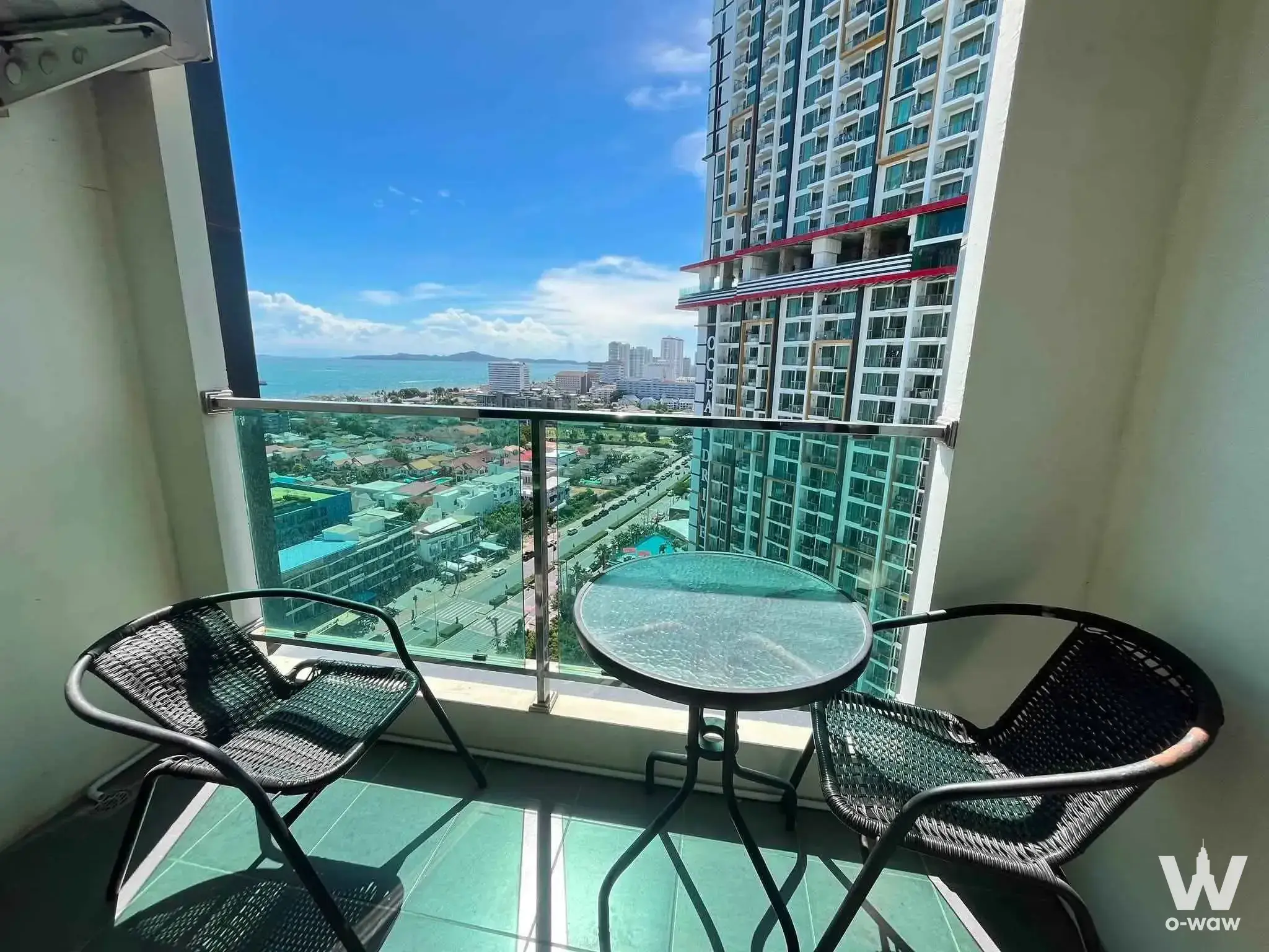 Balcony of a 1-bed condo for sale in Dusit Grand Condo View with ocean view and glass railing