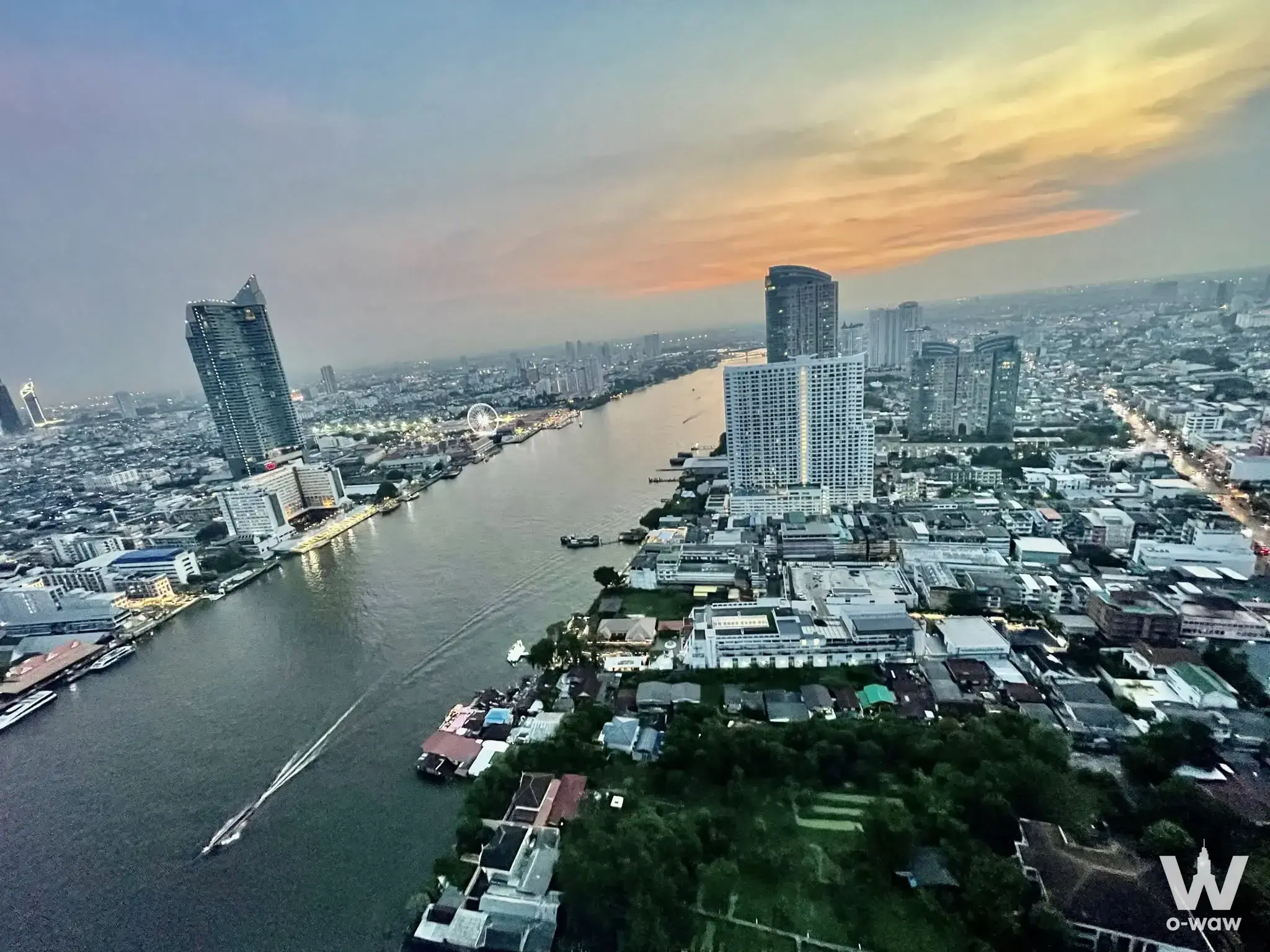 Sunset city view from a 2-bed condo for rent in Chapter Charoennakhon-Riverside