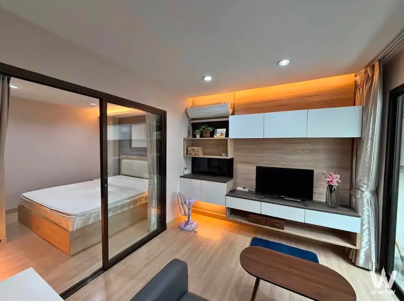 Furnished 1-bed townhouse in Siri Place Airport Phuket with warm amber LED lighting and light wood laminate flooring