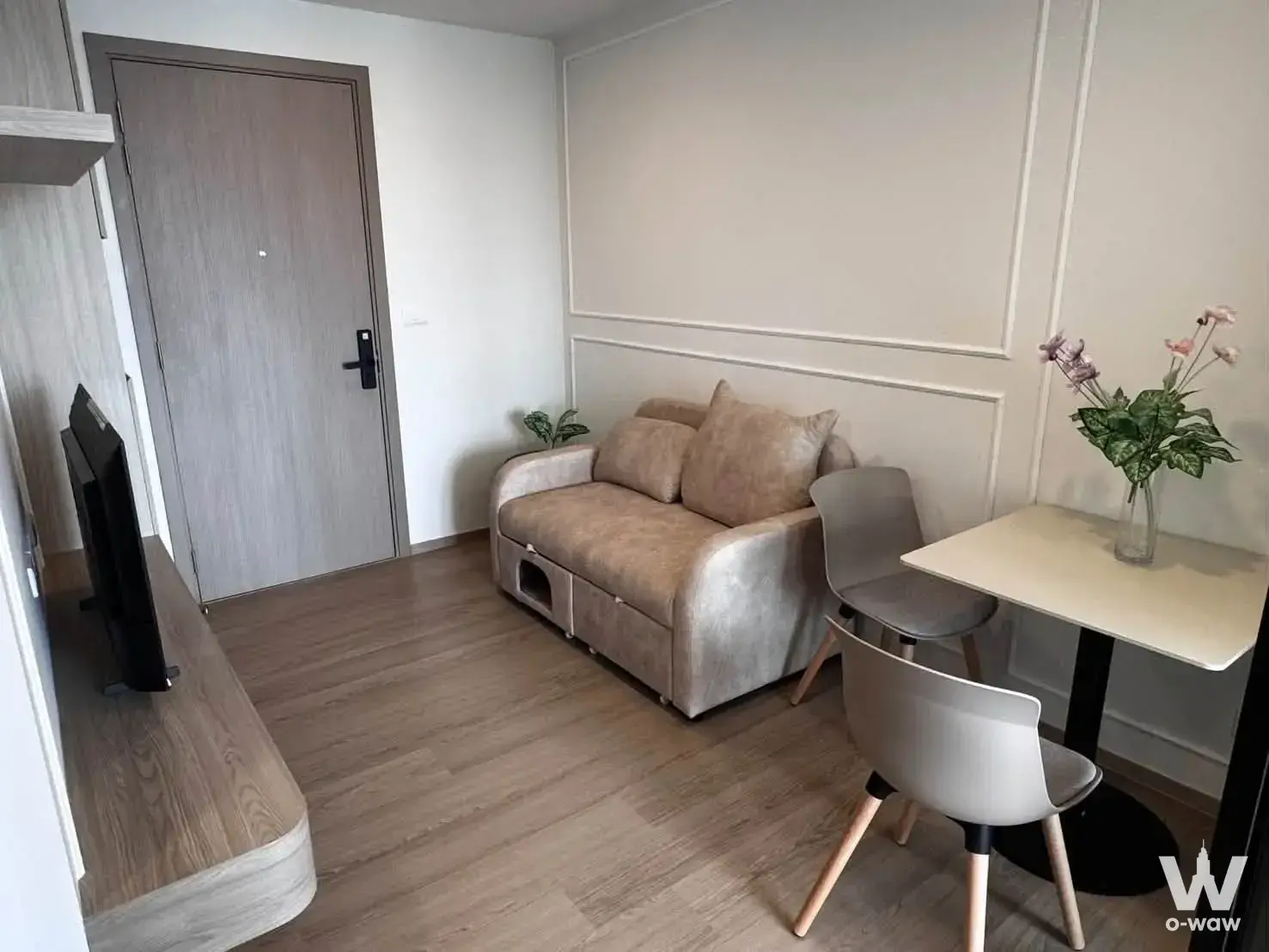 Origin Play Bangkhunnon 1-bed condo studio with beige storage sofa and modern dining setup