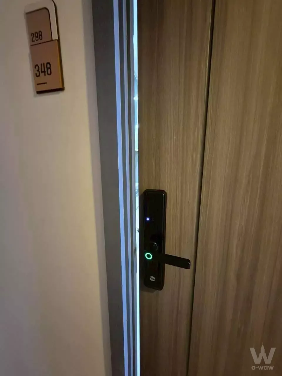 Light wood entry door with smart lock at Supalai Veranda Ramkhamhaeng 1-bed condo for rent