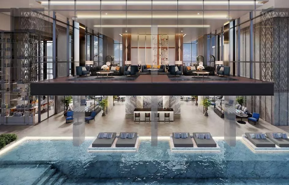 Double-height lobby with pool deck and lounge at The Address Siam 1-bed condo for sale in Ratchathewi