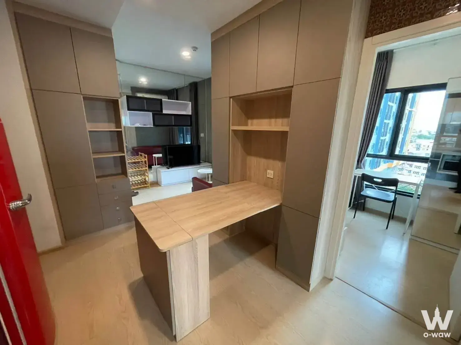 Study area in 2-bed condo for rent at The Tree Sukhumvit 71-Ekamai featuring built-in taupe cabinetry and light wood flooring