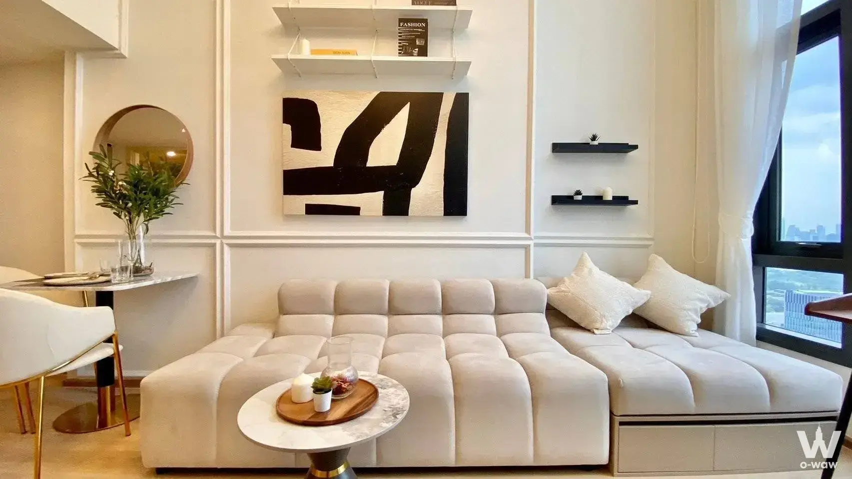 Luxury living room in Life Rama 4 - Asoke with sectional sofa, marble table, and skyline view