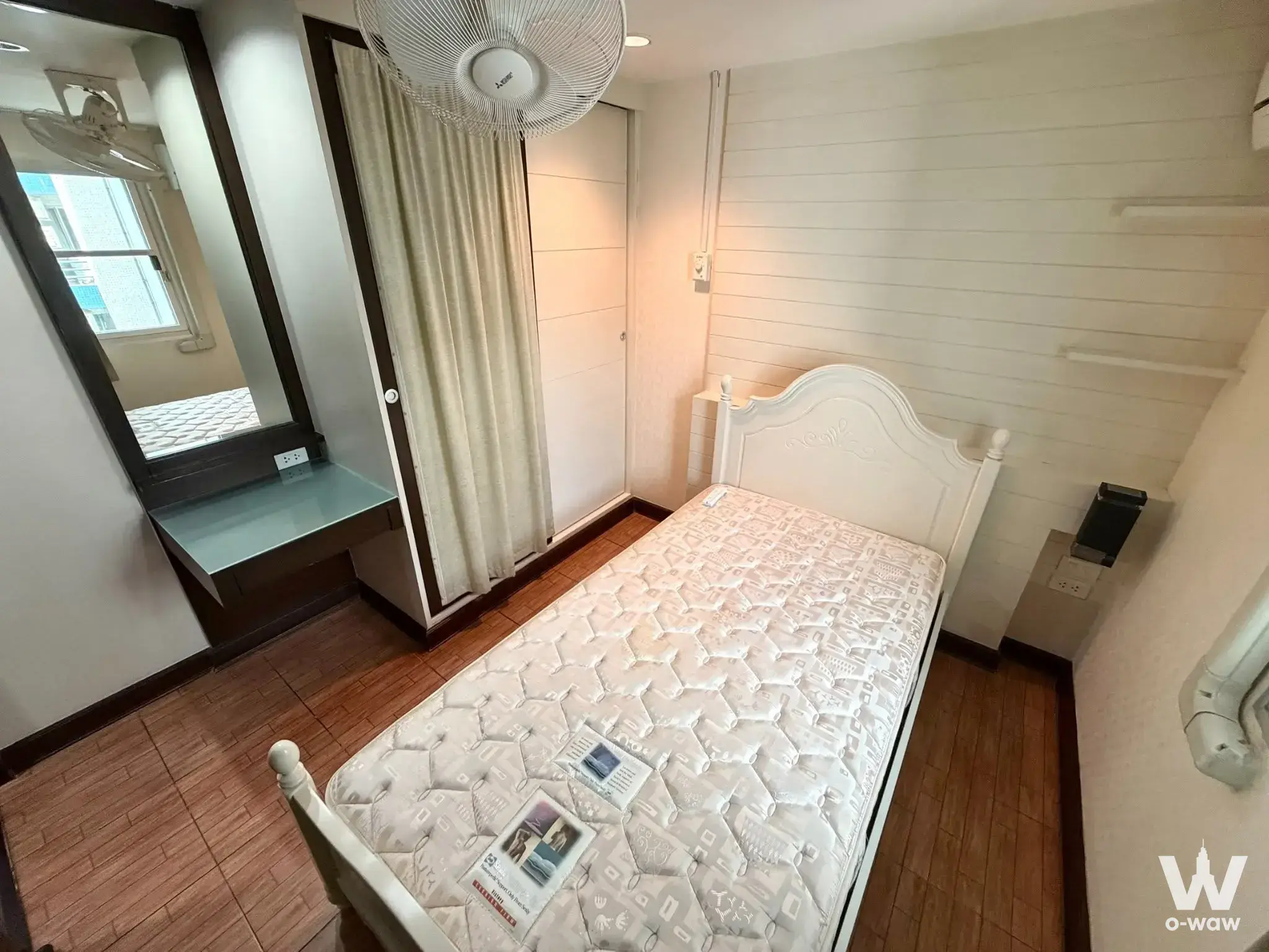 Waterford Park Rama 4 bedroom with white shiplap wall and large mirror reflecting the balcony