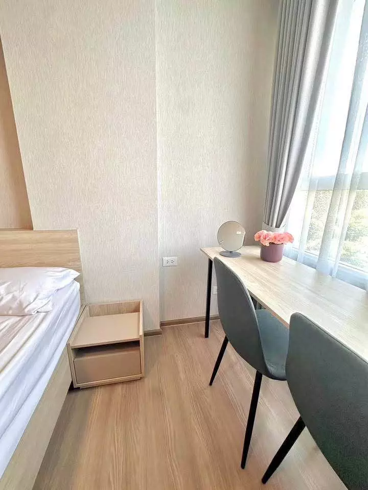 Bright 1-bed condo bedroom for rent at dcondo panaa with light wood furniture and large window