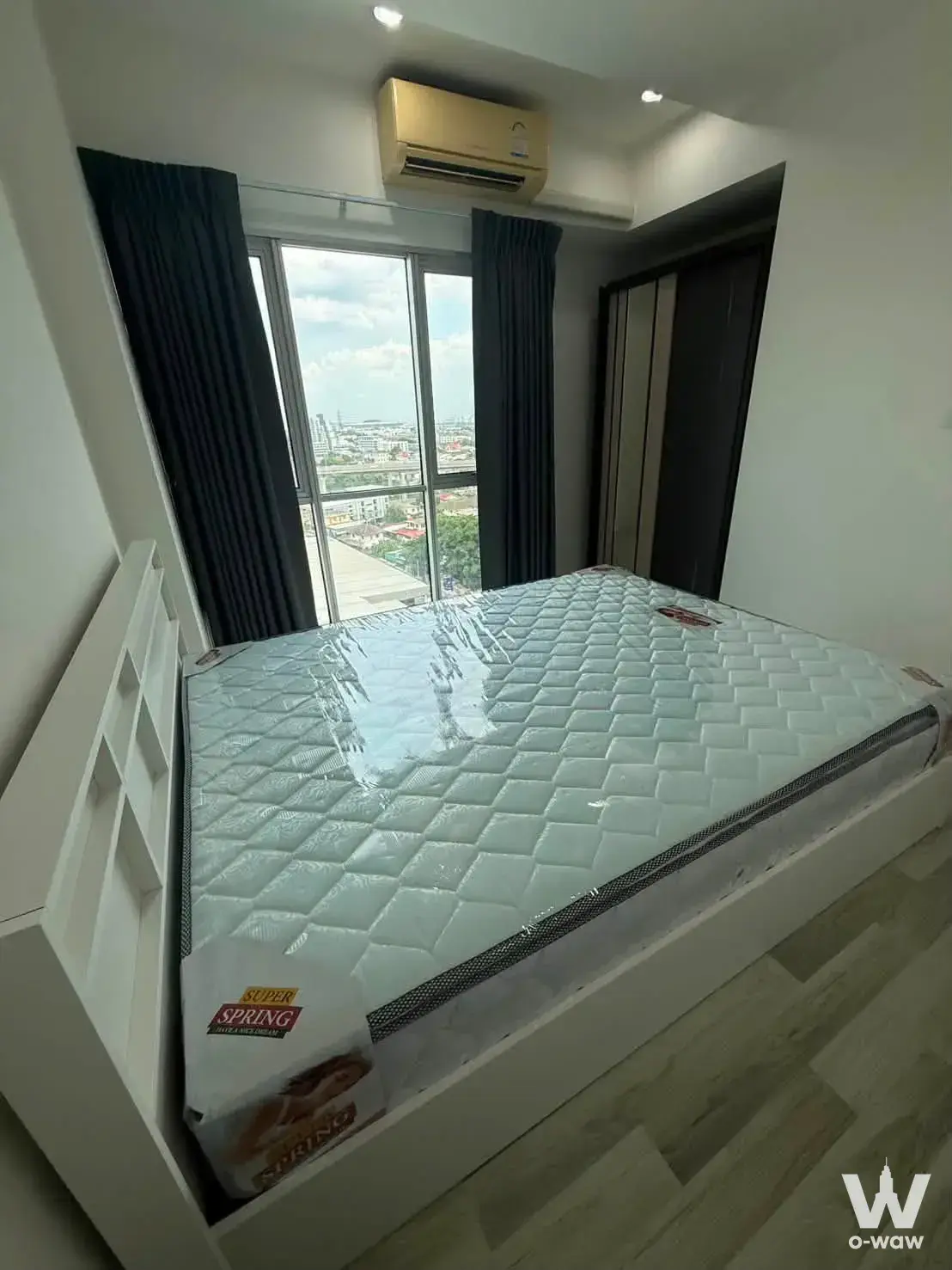 Unfurnished bedroom in 2-bed condo for rent at The Key Cheangwattana with city view