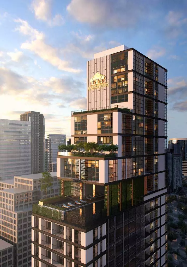Modern stepped condo tower for sale in The Lofts Asoke featuring rooftop infinity pool and lush green terraces