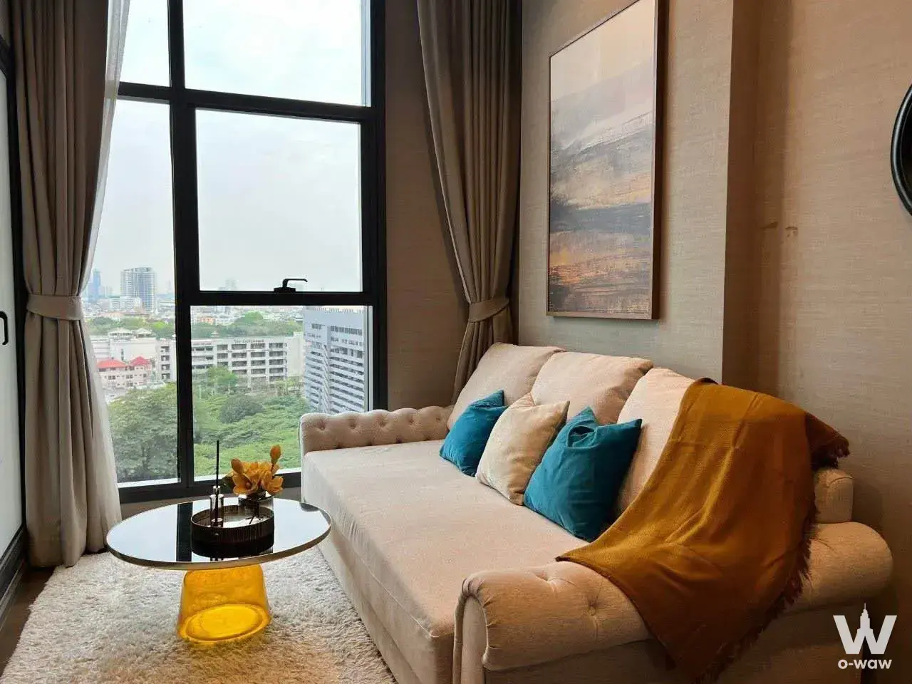 Teal accent sofa in a The Diplomat Sathorn 1-bed other for rent