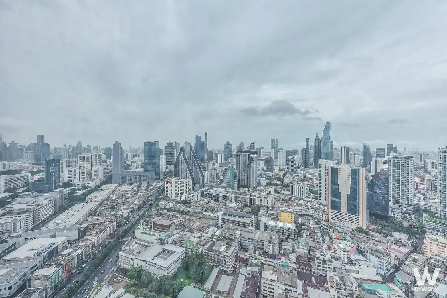 High-angle cityscape view from a 2-bed condo in Park Origin Chula-Samyan showing Bangkok's dense skyline under an overcast