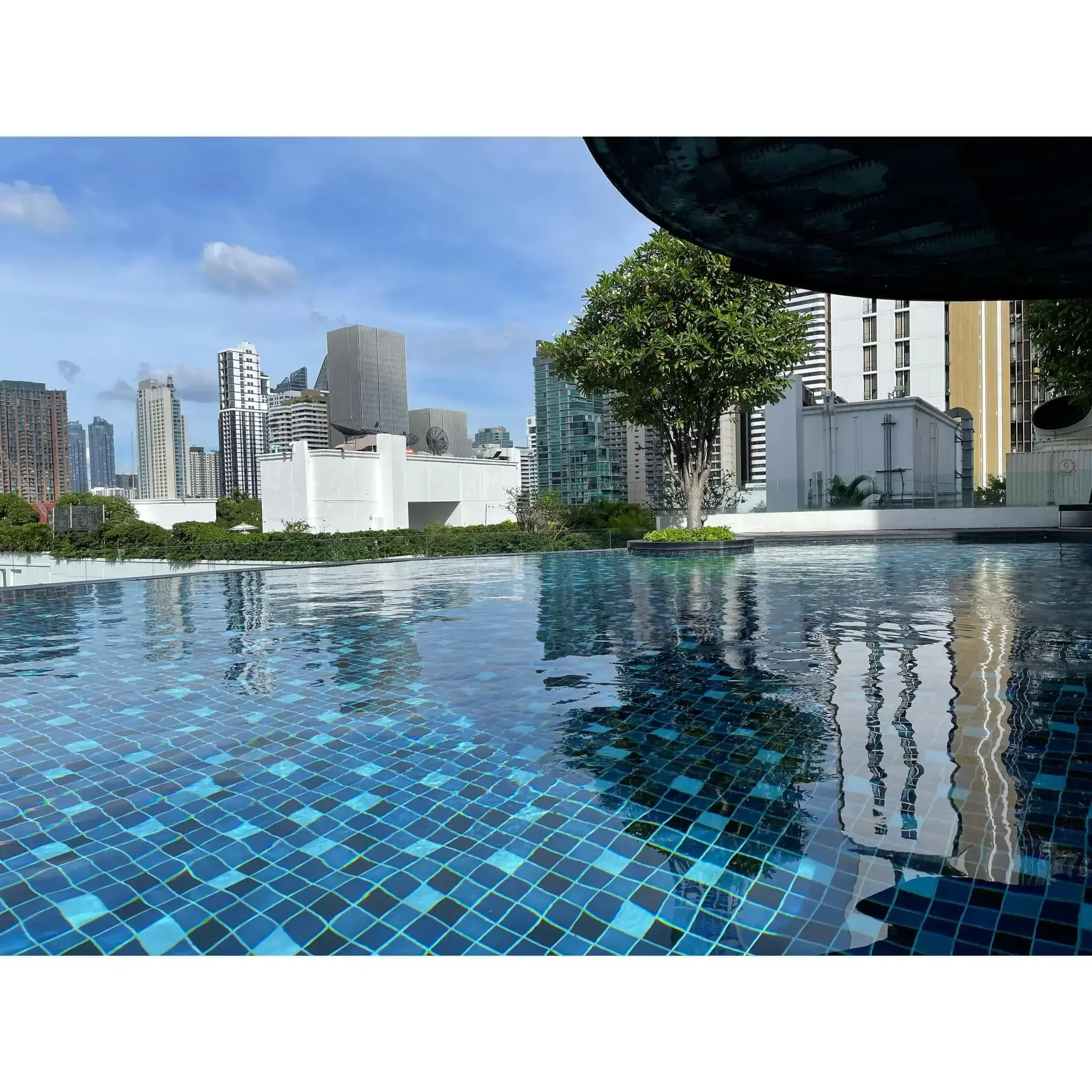 15 Sukhumvit Residences rooftop infinity pool with blue mosaic tiles and city skyline views
