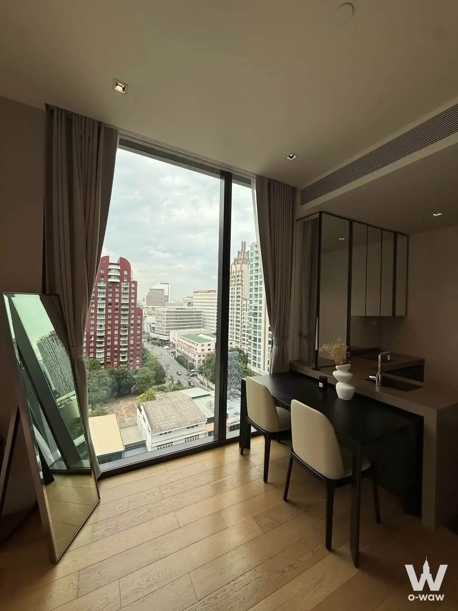 1-bed condo for rent in NOON Village Tower 1 featuring a dining nook with city views