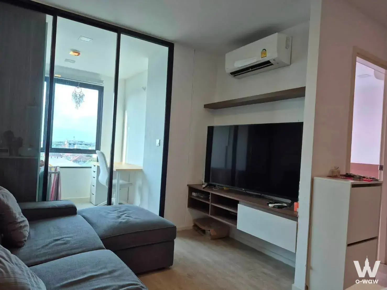 Living room with sectional sofa and study nook partition in Atmoz Ladprao 71 condo