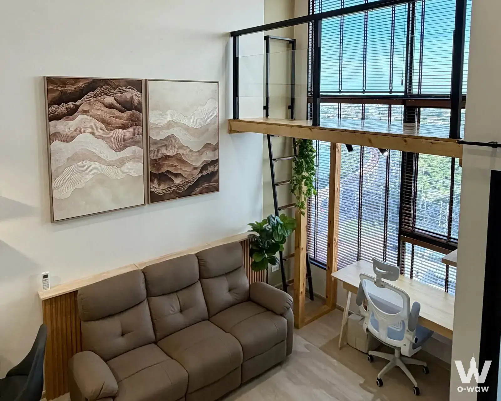 Origin Plug & Play E22 loft studio with mezzanine, mountain art, and city views