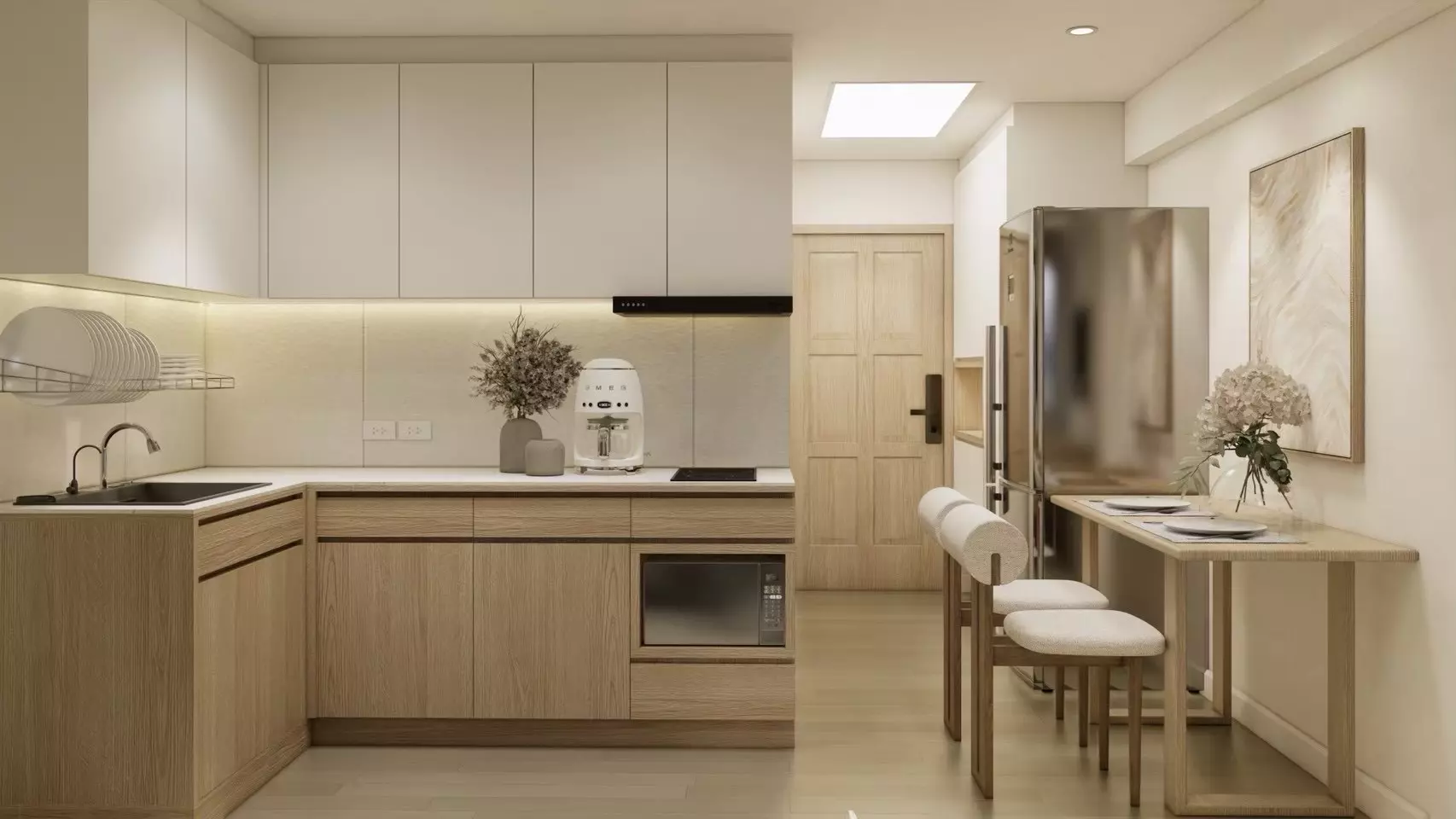 Modern open-plan kitchen with light oak cabinets and stainless steel appliances in 1-bed condo for sale at Raintree villa