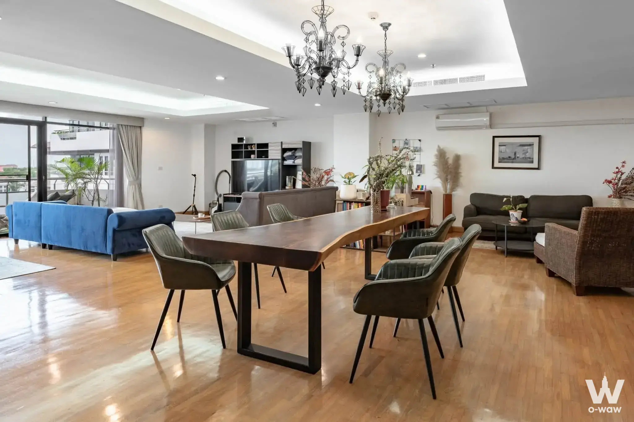 Modern living and dining area with hardwood floors for Lakeshore West condo