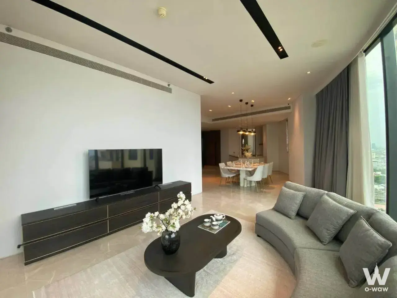 2-bed condo for rent in Banyan Tree Residences Riverside Bangkok featuring open-plan living with city skyline view