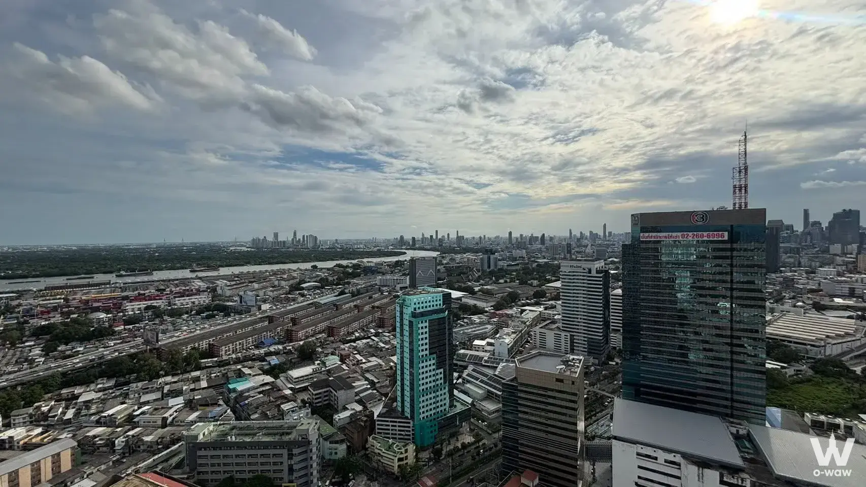 Panoramic city skyline view from Oka Haus showing the river curve and urban landscape