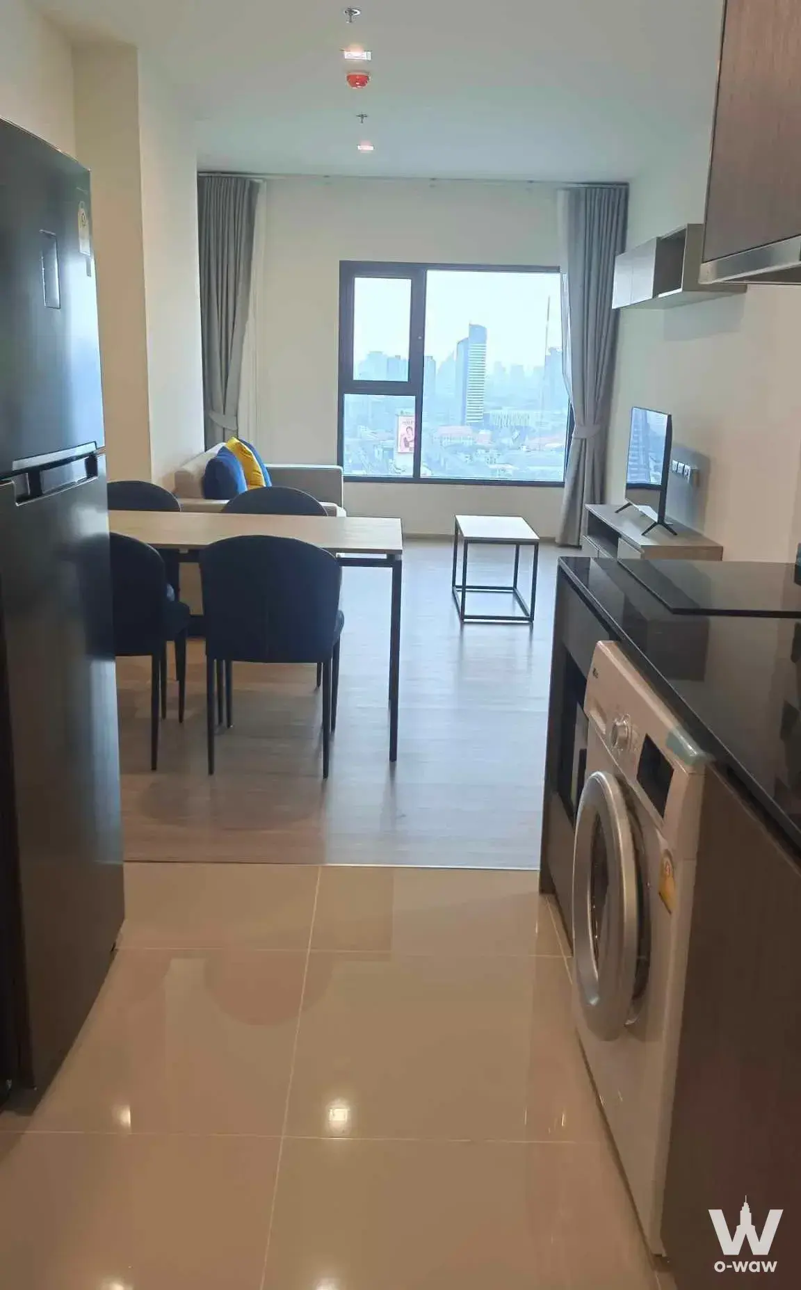 Furnished open-plan studio kitchen and living area for rent at THE BASE Phetchaburi-Thonglor