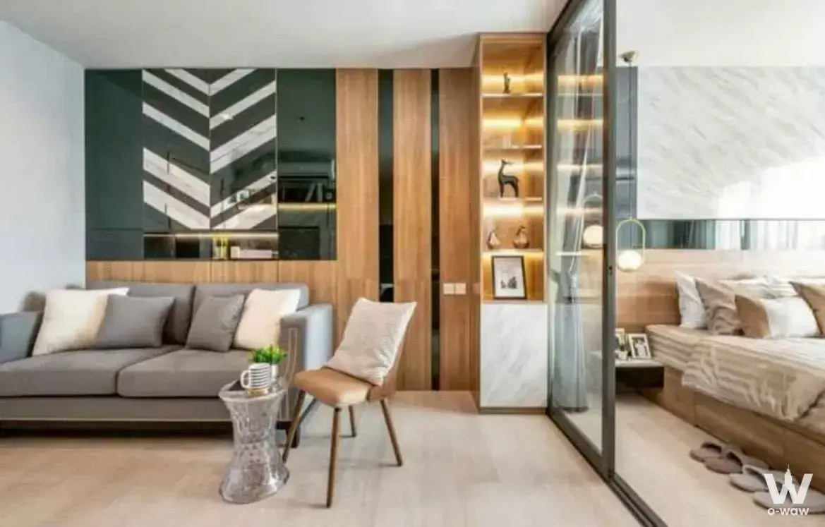 Modern 1-bed condo for rent in Life One Wireless featuring glass partition, green cabinetry, and marble accent wall