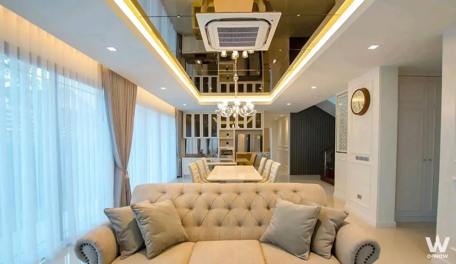 Spacious living and dining area in 4-bed house for rent at The Pavilla Bangbon 3 with tufted sofa and crystal chandelier