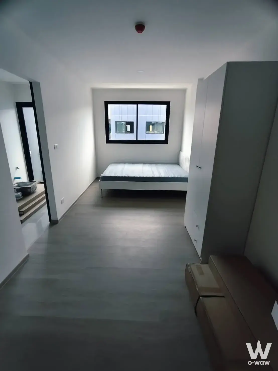 Spacious bedroom at 0-bed condo for rent in The Origin Bangkae with large window and modern wardrobe