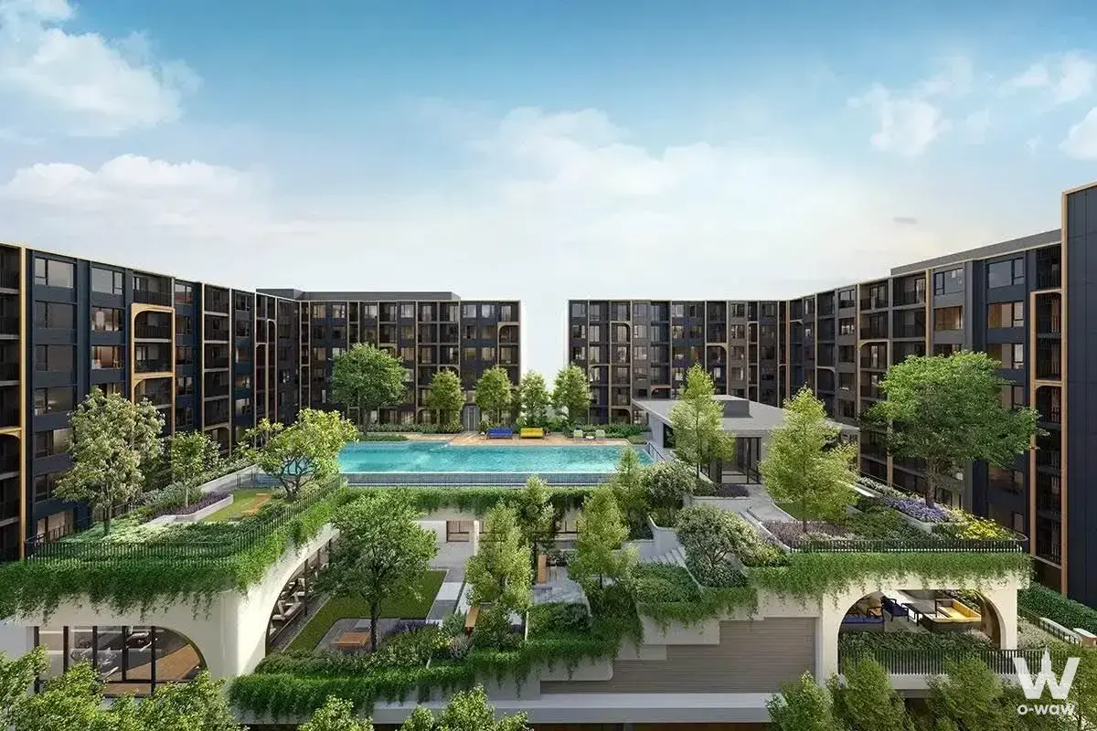 Exterior view of The Base Ratchada 19 condo with charcoal facades and a central courtyard pool