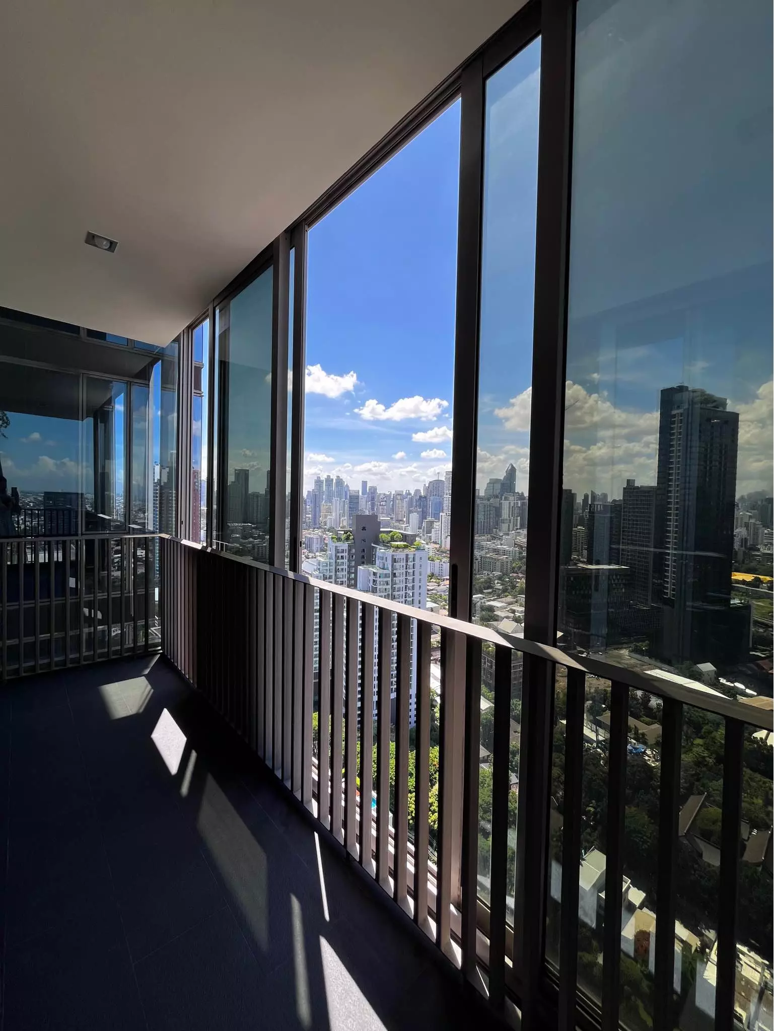 Spacious balcony with panoramic city views in 3-bed condo for rent at Ashton Morph 38