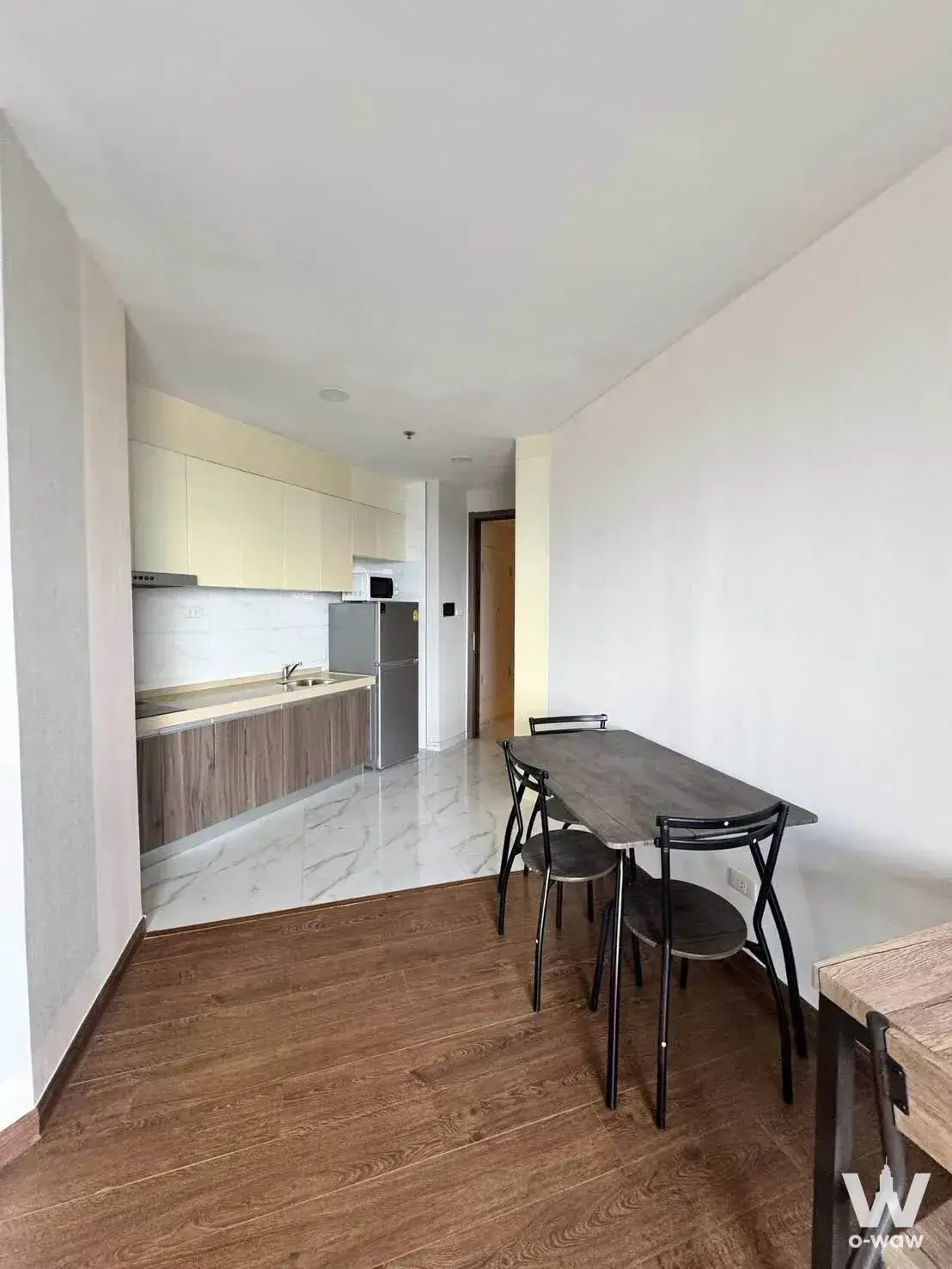 Compact kitchen and dining area in Artisan Ratchada with quartz counters