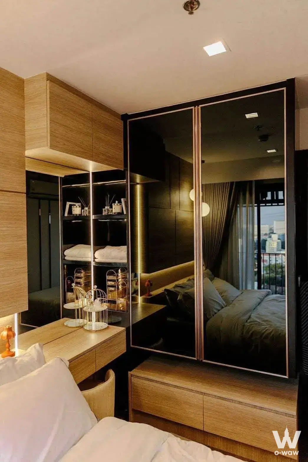 Master bedroom in Life Ladprao Valley with mirrored wardrobe and city skyline view