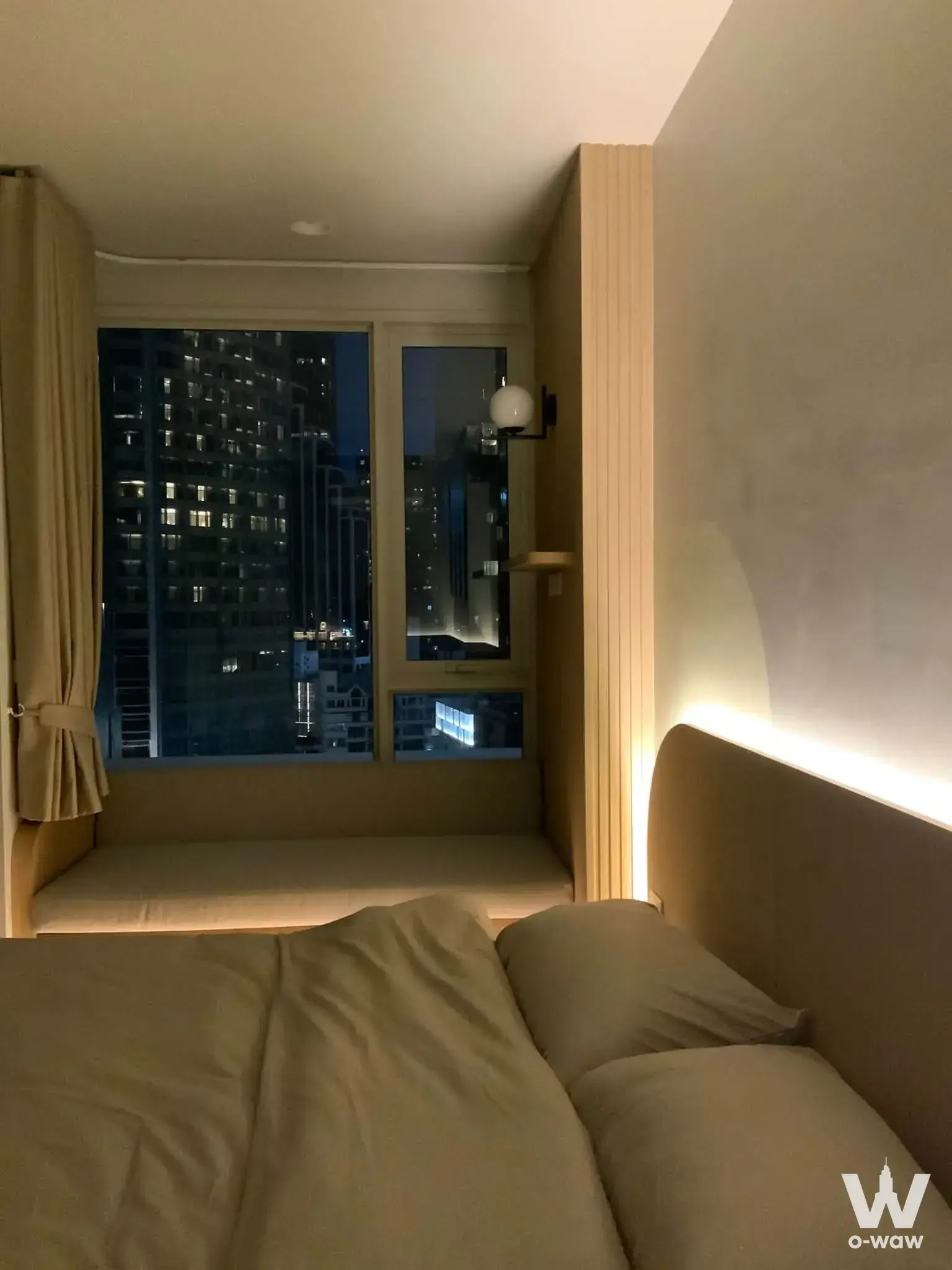 1-bed condo for sale in Culture Thonglor with warm LED headboard lighting and city night view
