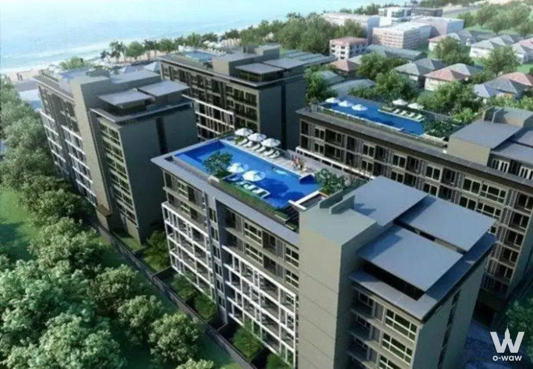 Aerial rendering of The Gallery Bearing condo towers featuring rooftop infinity pools and a beachfront ocean view