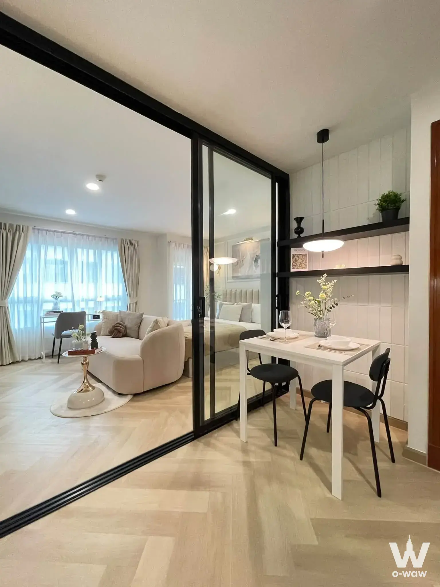 Open-plan studio for sale in PG2 Condominium with glass partition and modern decor
