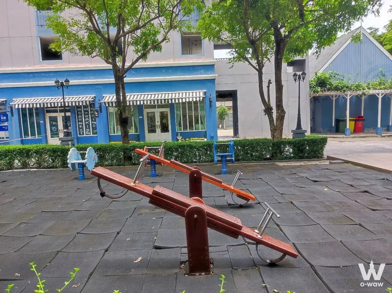 Children's playground with wooden seesaws and blue spring riders outside Chapter One Modern Dutch Rat Burana 33