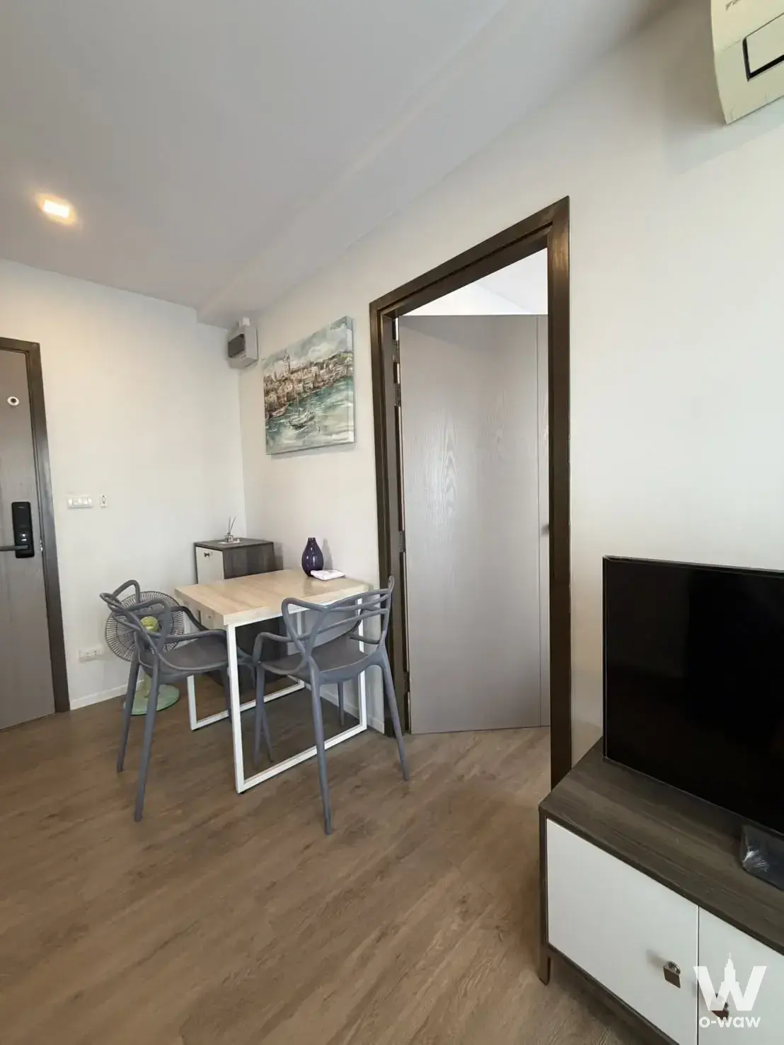 Living and dining area in a 1-bed condo for rent at The Nest Sukhumvit 64 with light wood flooring