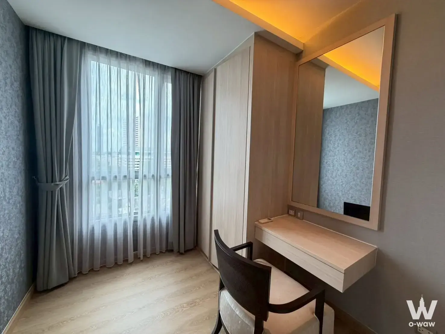 Bright bedroom in a 2-bed H Sukhumvit 43 condo with built-in wardrobe and city view