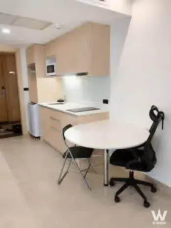 1-bed condo for sale in The Cliff Residence Condo with light-wood cabinetry and minimalist kitchenette