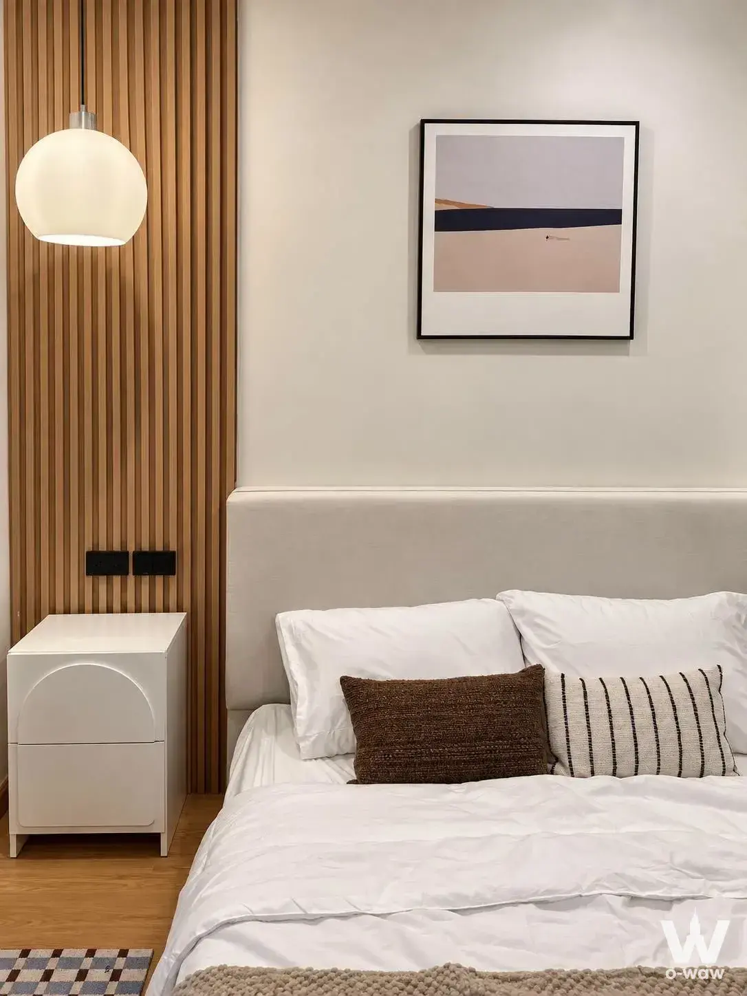 Modern bedroom with wood slat accent wall and cream pendant light in Supalai City Home Ratchada 10-V3