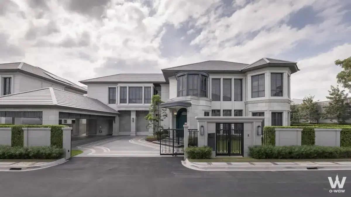 Luxury 5-bed house for rent in Narasiri Krungthep Kreetha with grey stone facade and gated driveway