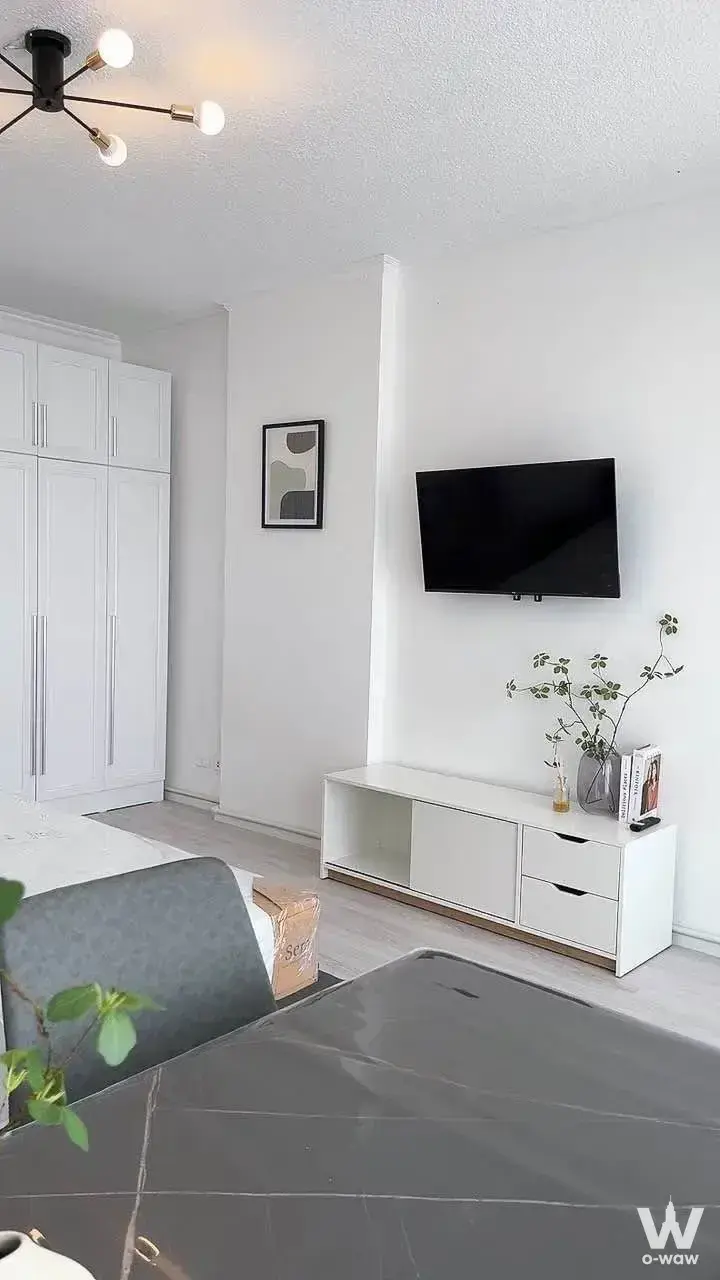 Bedroom in Lumpini Place Srinakarin with built-in wardrobe and modern chandelier