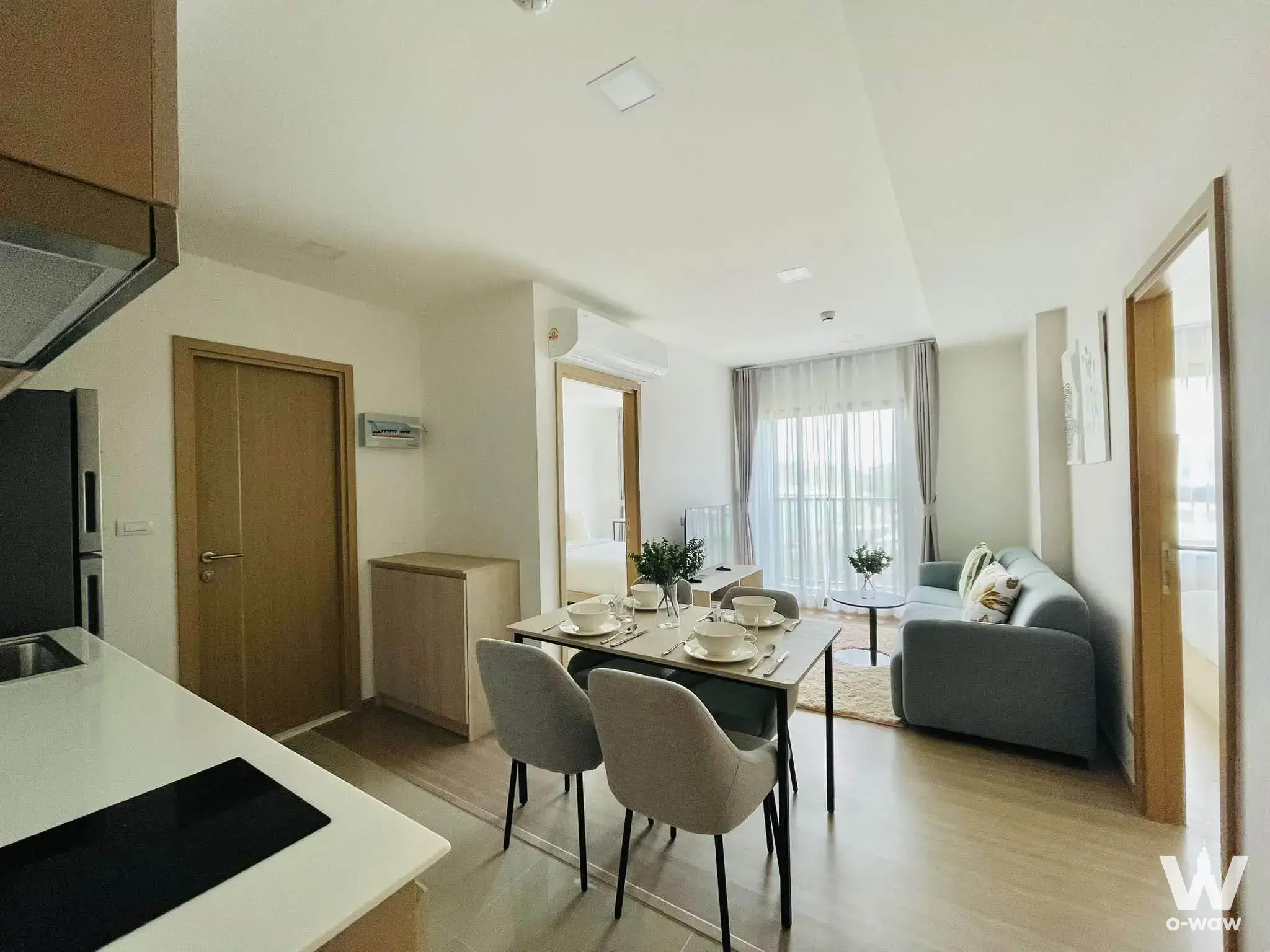 The Base Bukit Phuket 2-bed condo open-plan living dining kitchen area