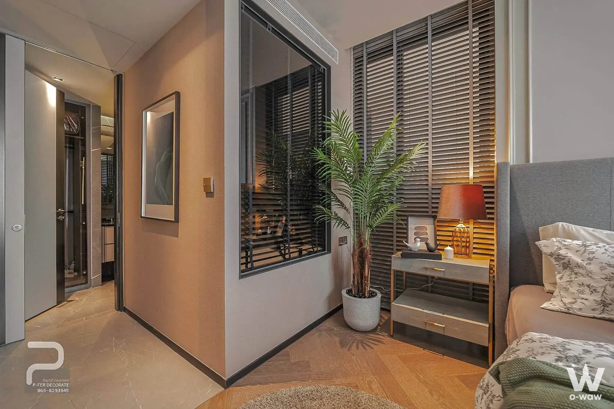 Bedroom with herringbone floors and palm tree in THE RESERVE 61 HIDEAWAY 1-bed condo