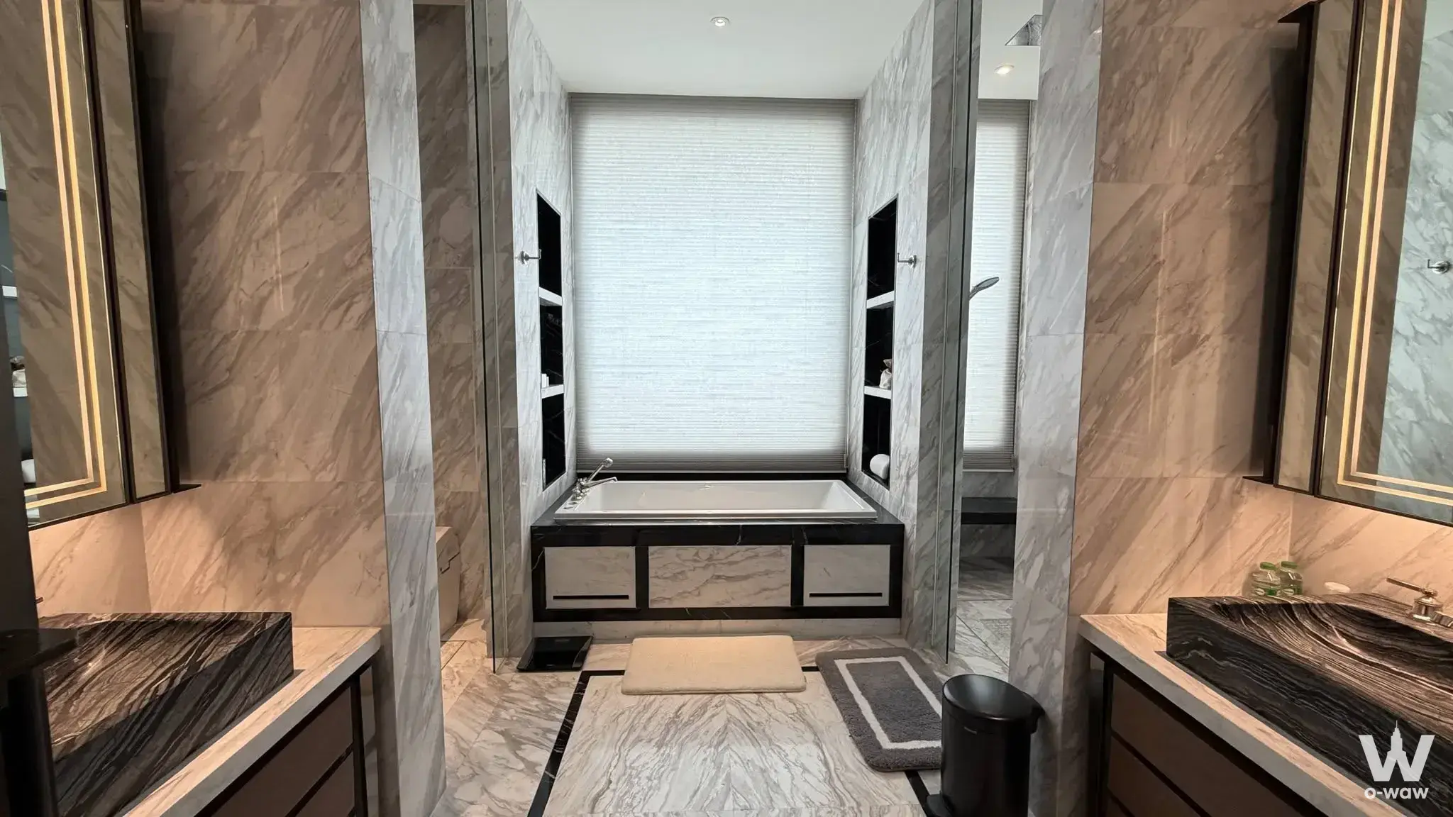Master bathroom in a 3-bed The Residences at Mandarin Oriental Bangkok condo with marble vanities and a soaking tub