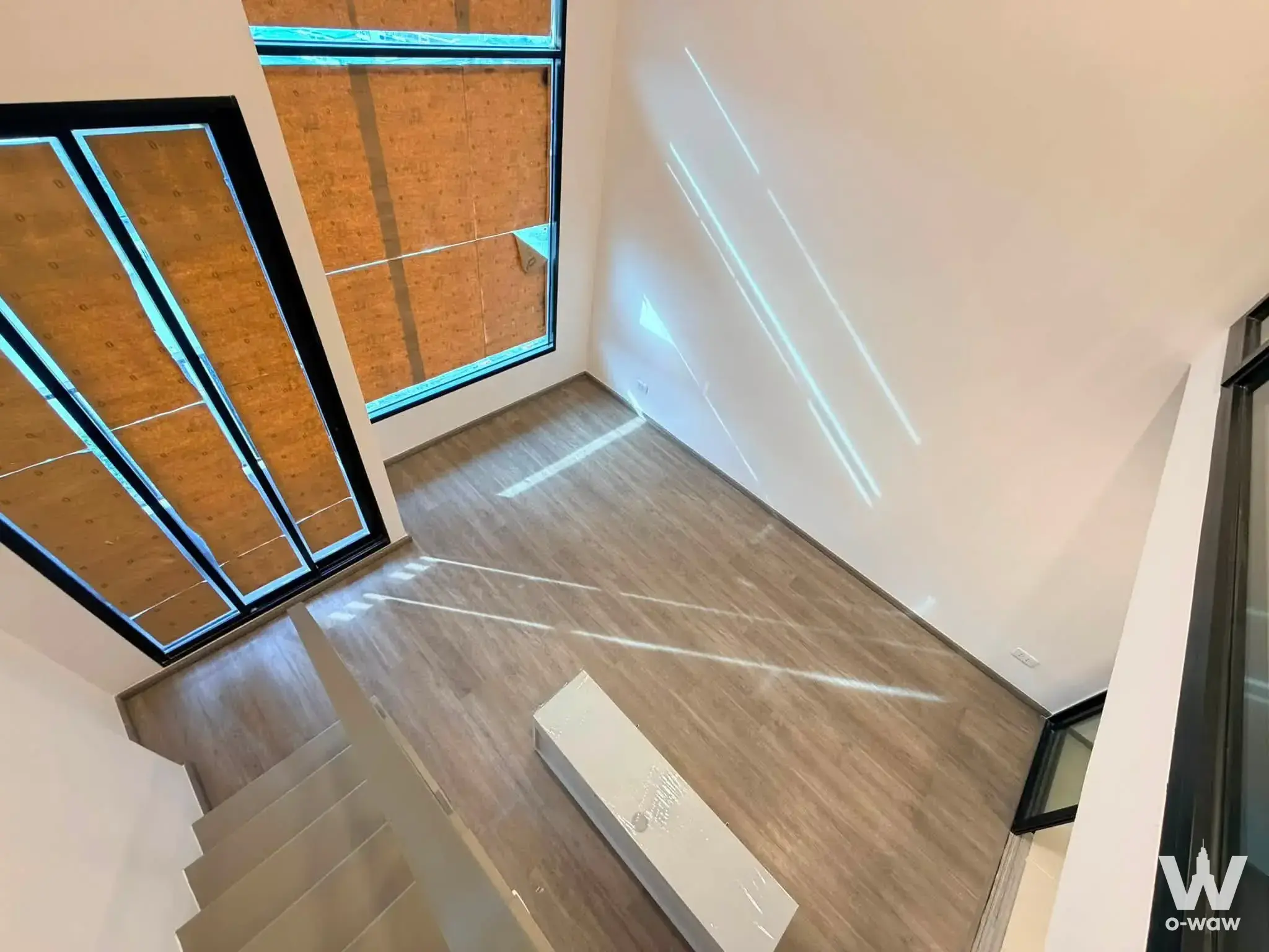Empty 1-bed unit for sale in So Origin Kaset Interchange showing staircase landing and natural light